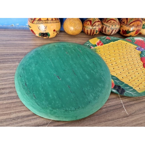 179 - 4 x Painted Wooden Round Trays with Fruit Designs, Together with 6 x Decorated / Painted Dried Gourd... 