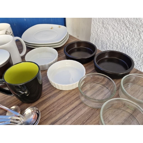 522 - Box of Kitchen Items; Assorted Mugs, Plates and Stainless Steel Cutlery