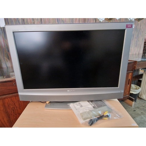 733 - Sony Bravia 32'' TV, (Model: KDL-32U2000) with Manual and Remote, Together with 3-Tier Light Wood an... 