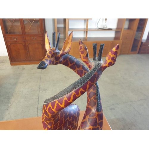 602 - Large Carved Wood Pair of Giraffe with Curved Necks, (Approx. H: 60cm)