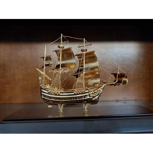 97 - Gold Plated Model of Sailing Ship on Base in Plastic Display Case, (Approx. 31 x 12 x 21cm)