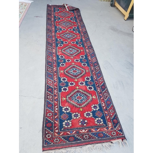 546 - Red / Blue / Brown Wool Rug in Geometric Pattern (310 x 75cm)