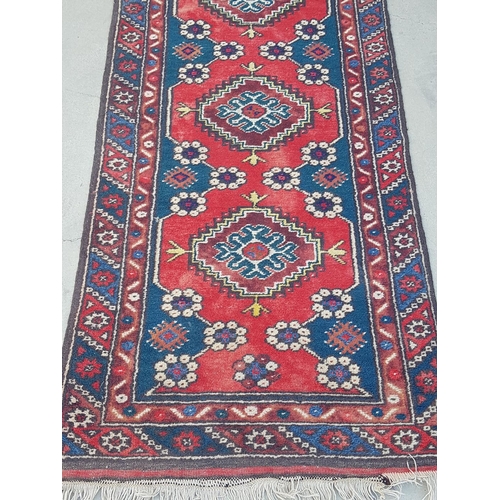 546 - Red / Blue / Brown Wool Rug in Geometric Pattern (310 x 75cm)