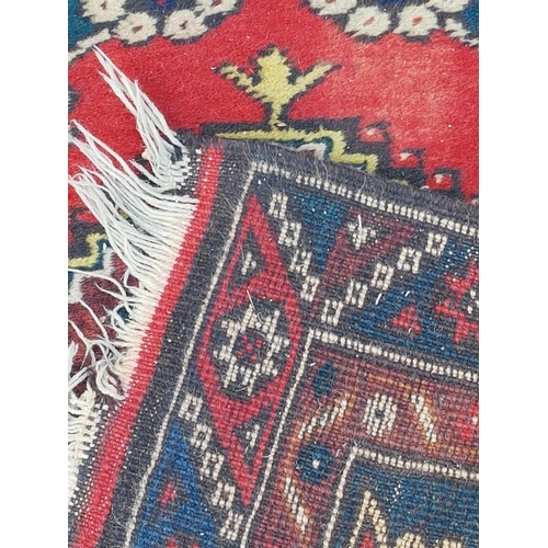 546 - Red / Blue / Brown Wool Rug in Geometric Pattern (310 x 75cm)