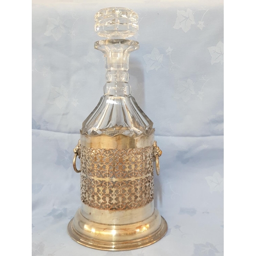 145 - Vintage Cut Glass Decanter in White Metal Holder Decorated with Lion's Head (H:33cm)