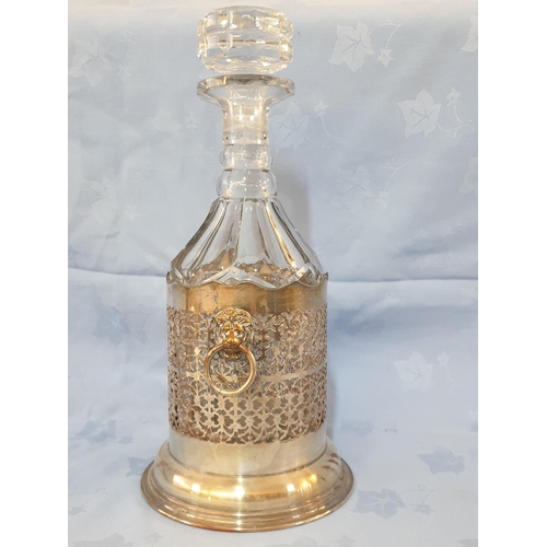 145 - Vintage Cut Glass Decanter in White Metal Holder Decorated with Lion's Head (H:33cm)