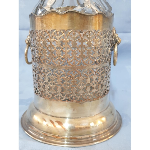 145 - Vintage Cut Glass Decanter in White Metal Holder Decorated with Lion's Head (H:33cm)