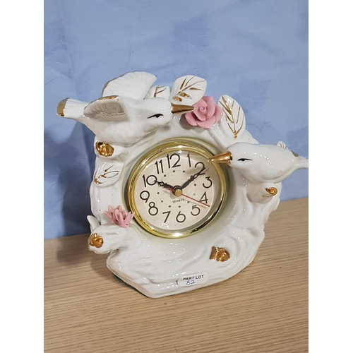 82 - 3 x Porcelain Items; Dog Ornament, Clock with Birds and Candlestick, (3)