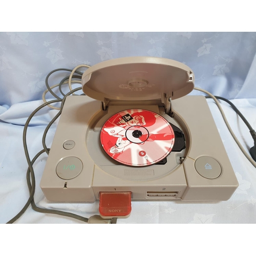 181 - Console Playstation 1 with 1 x Controller and Games