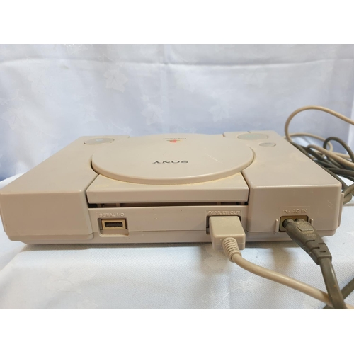 181 - Console Playstation 1 with 1 x Controller and Games