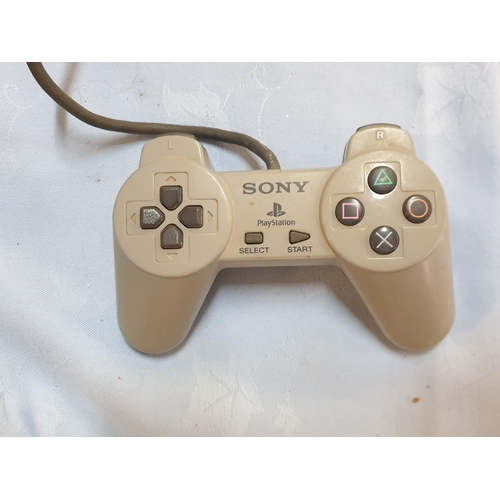 181 - Console Playstation 1 with 1 x Controller and Games