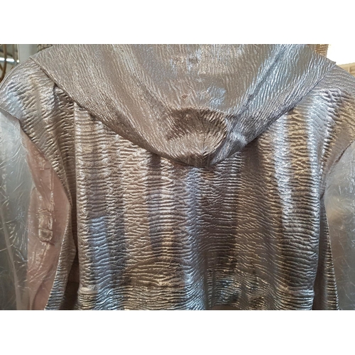 817 - Fashion Long Transparent Jacket with Silver Hood Decorated with Silver studs Zipp and Large Transpar... 