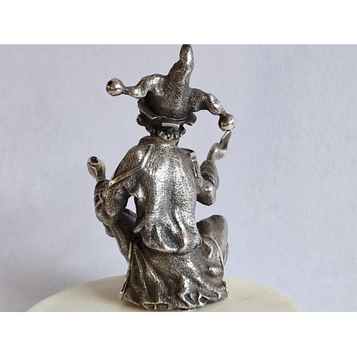 52 - Sterling Silver Jester Figurine, Seated Holding Pack of Cards, (Approx. H: 5cm)