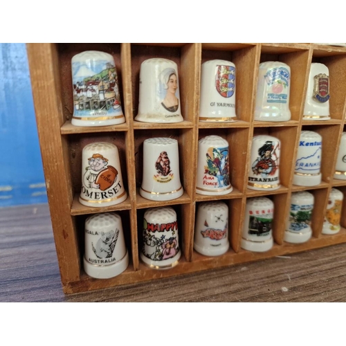 32A - Collection of 42 x China Thimbles in Wooden Display Case, (Approx. 21 x 26 x 2.5cm)