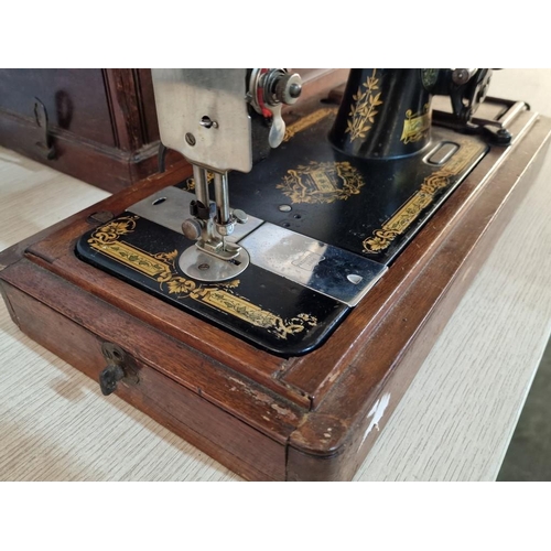 153 - Antique Cast Iron Singer Sewing Machine in Wooden Case, Manual Wind, Decorative Body, Serial Number ... 