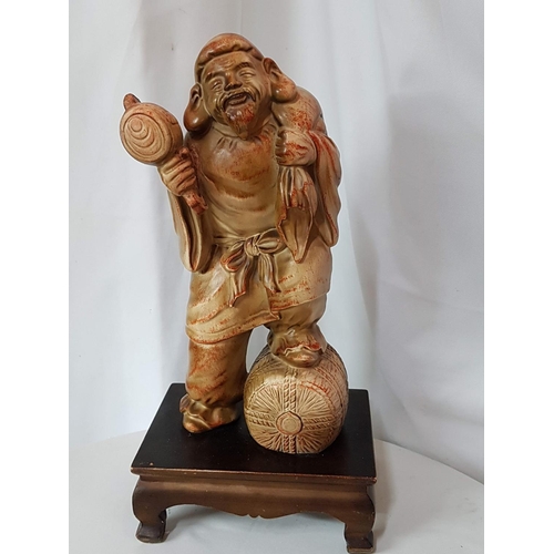 810 - Austin Home Collection Sculpture of an Asian Make Seller on Wooden Base (Sculpture 33.5 x 13.5cm and... 