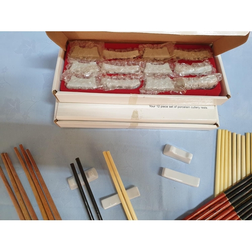 345 - 19 x Pair of Chopsticks Together with 2 x Sets of Porcelain Cutlery Sets (12pcs each)