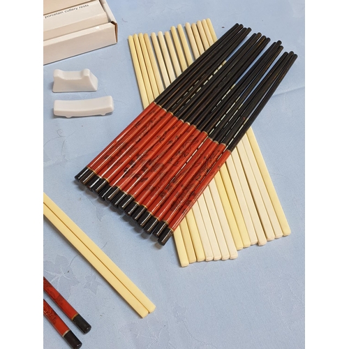 345 - 19 x Pair of Chopsticks Together with 2 x Sets of Porcelain Cutlery Sets (12pcs each)