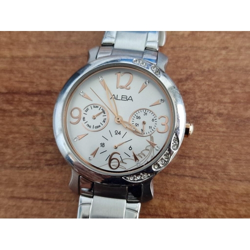 57 - Alba Stainless Steel Wrist Watch, (Model: V33J-X055) with Clear Stone Decorations in the Bezel, Whit... 