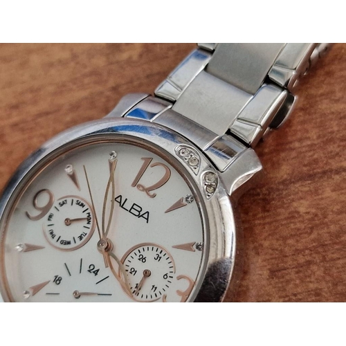 57 - Alba Stainless Steel Wrist Watch, (Model: V33J-X055) with Clear Stone Decorations in the Bezel, Whit... 