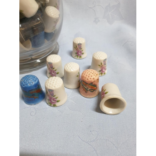 693 - Huge Collection of 120pcs of Vintage Style Porcelain Thimbles in Glass Vase