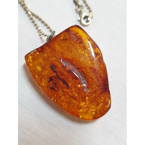 116 - Large Amber Stone Pendant on .925 Silver Chain and Pair of Amber .925 Silver Earrings, Total Weight ... 