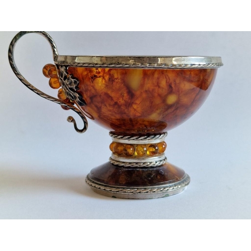 90 - Natural Amber Cup with Decorative White Metal Mount, Handle and Base, (Approx. H: 8cm), Together wit... 