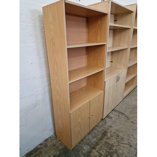 677 - Light Wood Effect Bookcase Over Double Cupboard, (Approx. 80 x 36 x 180cm)