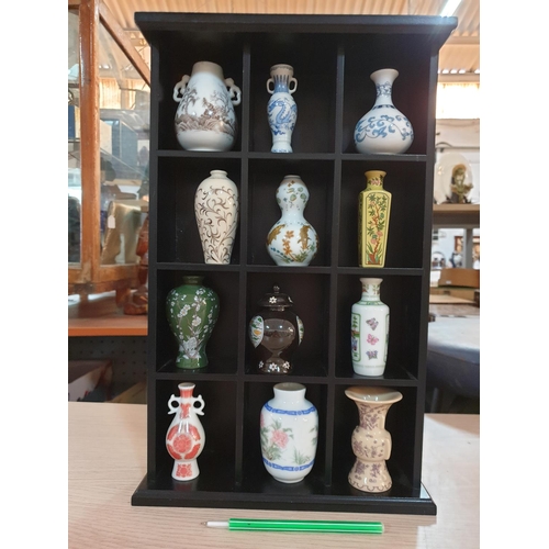 618 - Collection of Mini Chinese Vases / Urns (12) in Wall Standing  Display Unit (8.5 x 26 x 41cm)