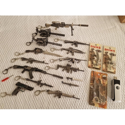 119 - Large Collection of Assorted Key Rings with Ornamental Guns, Rocket Launcher, Knives, etc (18)