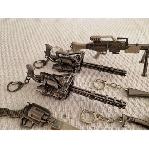 119 - Large Collection of Assorted Key Rings with Ornamental Guns, Rocket Launcher, Knives, etc (18)