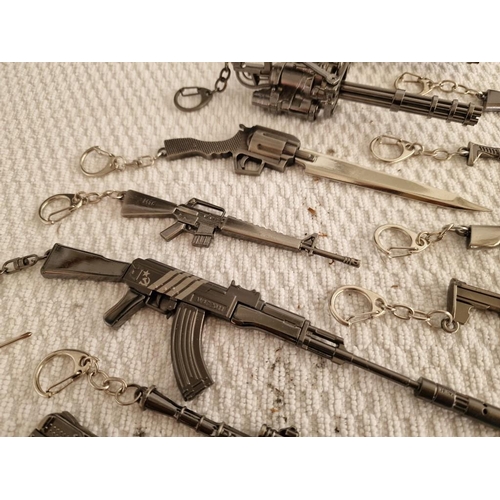 119 - Large Collection of Assorted Key Rings with Ornamental Guns, Rocket Launcher, Knives, etc (18)