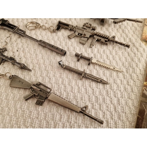 119 - Large Collection of Assorted Key Rings with Ornamental Guns, Rocket Launcher, Knives, etc (18)