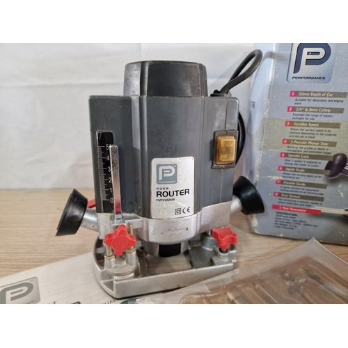 134 - Performance Woodworking Router, 1020W, (Model: FMTC1020R), with Box, Manual, Guide and Qty of Router... 