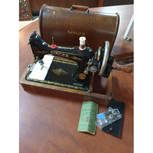 22 - Antique Hand Cranked Singer Machine Complete with Cover, Original Instruction Book and Accessories (... 