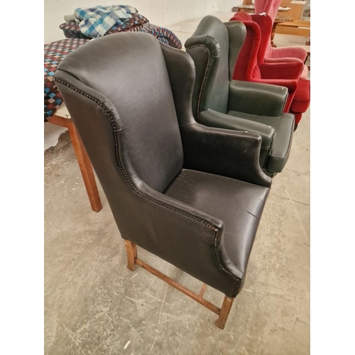 812 - Black Leatherette Wing Back Armchair Over Wooden Legs, (a/f)