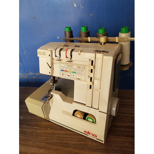 145 - Elna Lock Pro4 De Electronic Overlock Sewing Machine (Un-Tested) with Quantity of Colourful Sewing T... 