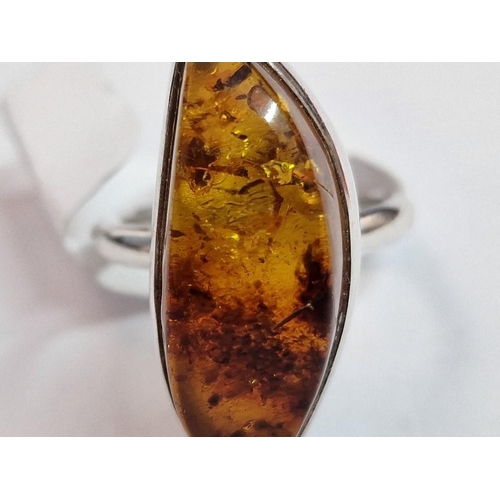 202 - Sterling Silver Ring Set with Large 'Eye' Shape Amber, (Approx. Size: Q, Weight: 9.2g)