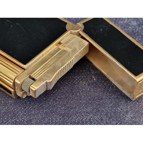 106 - S.T. Dupont (Paris) Black Chinese Lacquer & Gold Table Lighter, (Approx. 12.5 x 3.5 x 1.2cm)