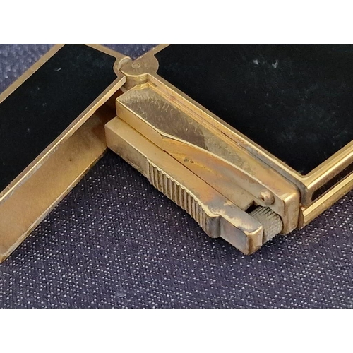 106 - S.T. Dupont (Paris) Black Chinese Lacquer & Gold Table Lighter, (Approx. 12.5 x 3.5 x 1.2cm)