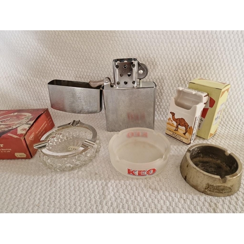 616 - Oversized White Metal Vintage Lighter, Together with 4 x Ashtrays; Keo, Golden Virginia, Camel Filte... 