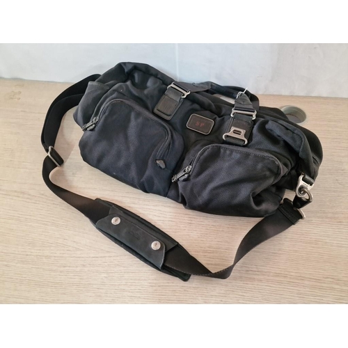 696 - ***CANNOT FIND***
Black Colour 'Tumi' Travel Bag