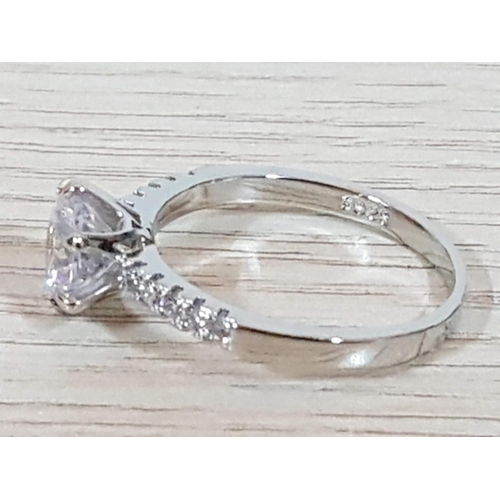 217 - Silver Solitaire Ring with Side Small Clear Stones and Large Clear Crystal Stone in Center in Diamon... 