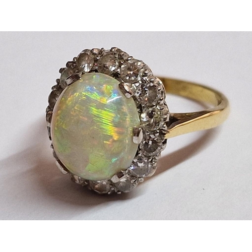 110 - 18ct Gold, Opal (?) and Diamond Ring; Oval Shape Centre Stone, Approx. 11 x 9mm Overall with 14 x Su... 