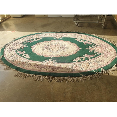 447 - Chinese Woollen Oval Carpet Pink / Blue Floral Pattern and Green Background (276 x 170cm)