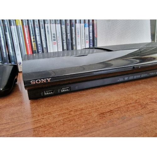 25A - Sony PS3 (PlayStation 3), (Model: CECH-4203C), with 2 x Controllers, Microphone and Collection of Ga... 