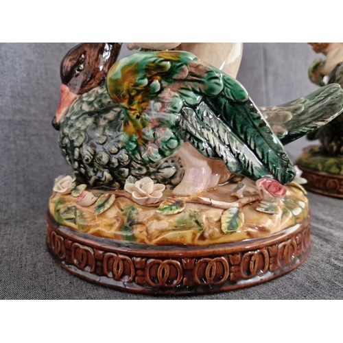 125 - 2 x Continental Style Porcelain Cherubs Playfully Riding Swans, (Approx. H: 22cm, Base: 20 x 15.5cm ... 