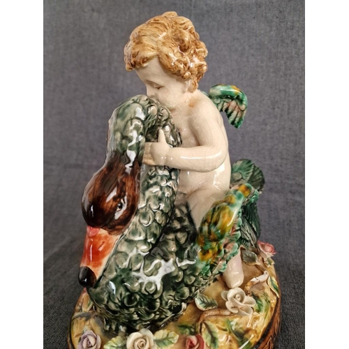 125 - 2 x Continental Style Porcelain Cherubs Playfully Riding Swans, (Approx. H: 22cm, Base: 20 x 15.5cm ... 