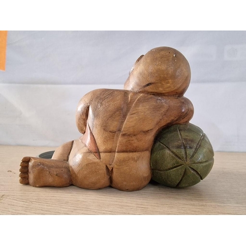 28 - Wooden Baby Buddha Resting on a Watermelon, (Approx. 25 x 18cm Overall)