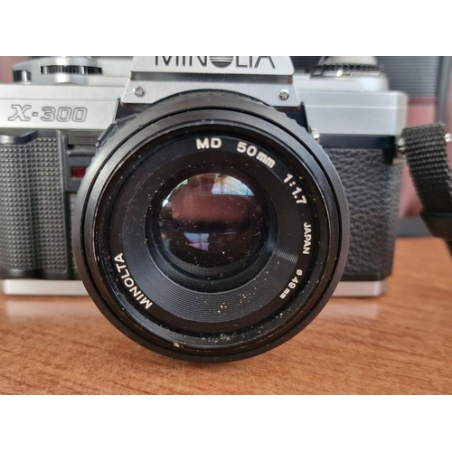 735 - Minolta X-300 Camera with Minolta MD 50mm Lens and External Flash Unit, Together with Camera Bag, (U... 